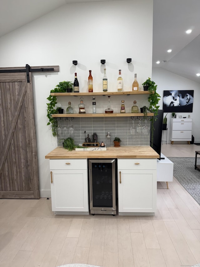 8 Hubbard Rd, North Branford, CT 06471 - indoor dry bar with wine cooler, lofted ceiling, light wood-style floors, and recessed lighting