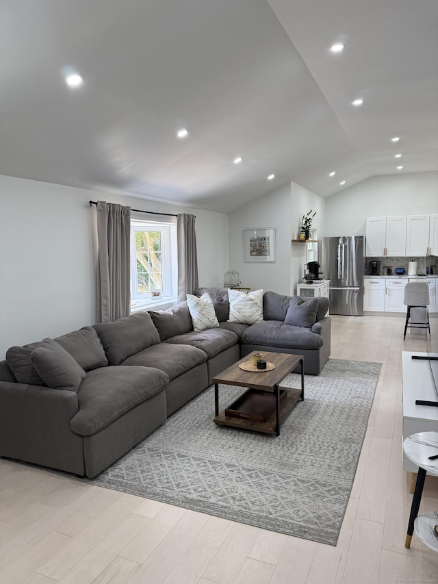 8 Hubbard Rd, North Branford, CT 06471 - living room featuring vaulted ceiling, recessed lighting, and light wood finished floors