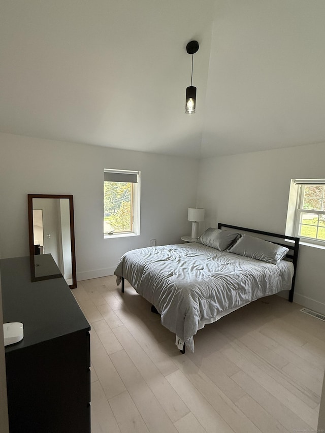 8 Hubbard Rd, North Branford, CT 06471 - bedroom with baseboards, vaulted ceiling, and light wood-style floors