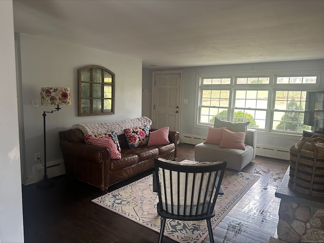living room featuring wood-type flooring, a baseboard radiator, and baseboard heating