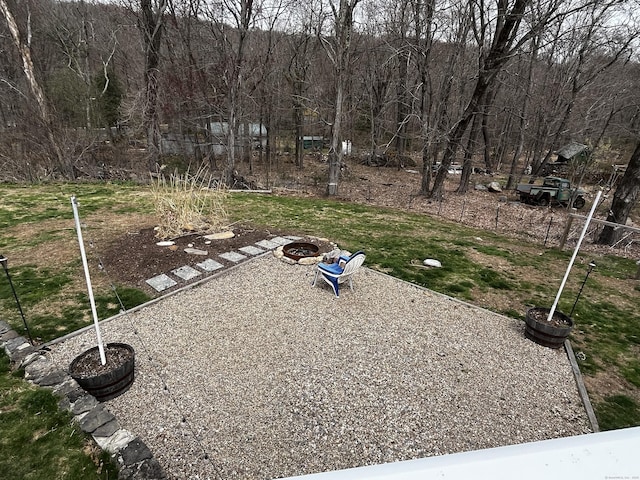 view of yard with an outdoor fire pit