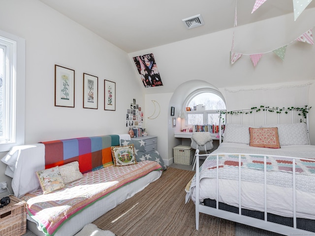 bedroom with visible vents and baseboards