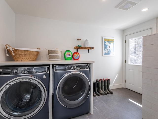 laundry area featuring visible vents, washing machine and clothes dryer, laundry area, recessed lighting, and tile patterned floors