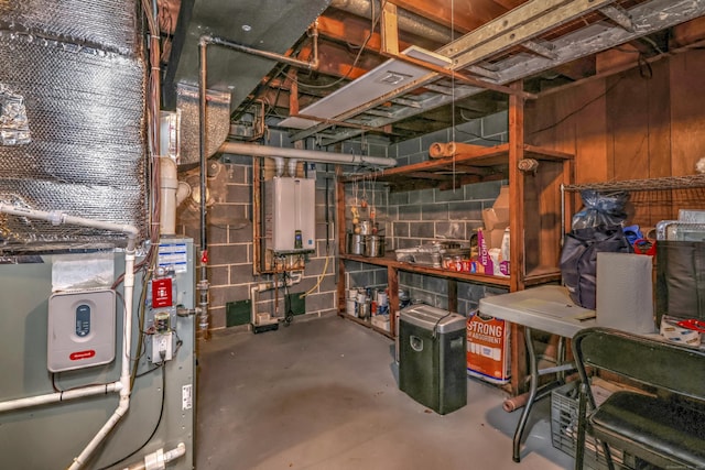 unfinished below grade area with concrete block wall and tankless water heater