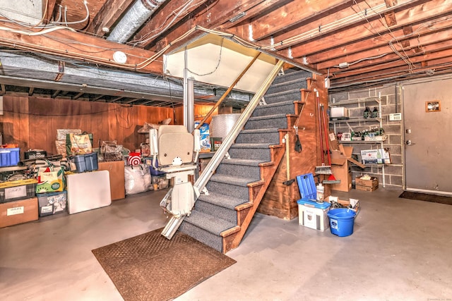 unfinished below grade area featuring stairs