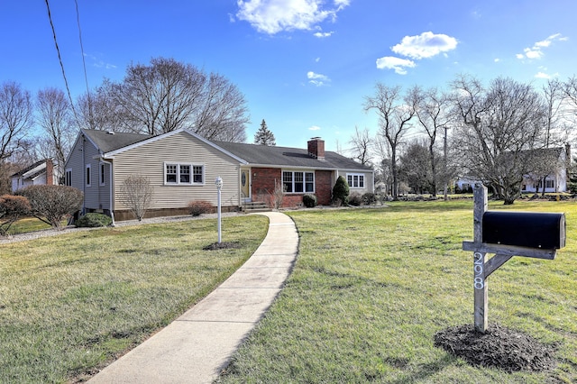 view of front facade featuring a front yard and a chimney