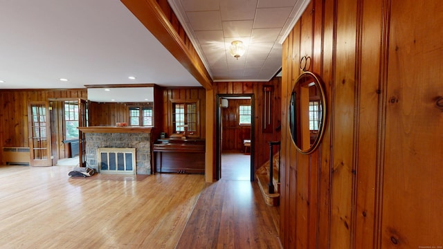 85 Hillcrest Ter, Meriden, CT 06450 - foyer entrance with wooden walls, plenty of natural light, crown molding, light wood-style flooring, and radiator