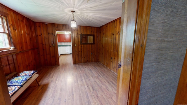 85 Hillcrest Ter, Meriden, CT 06450 - hallway with light wood-style flooring and wooden walls