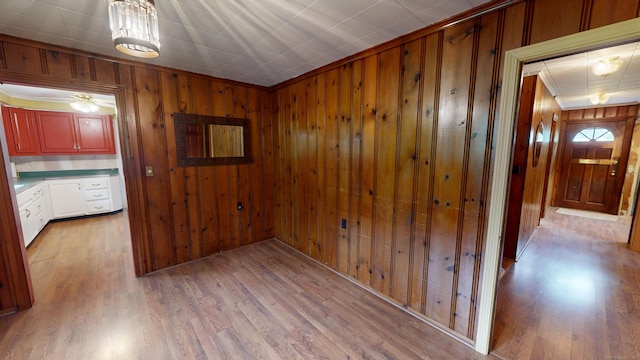 85 Hillcrest Ter, Meriden, CT 06450 - hallway with wood finished floors, wood walls, and crown molding