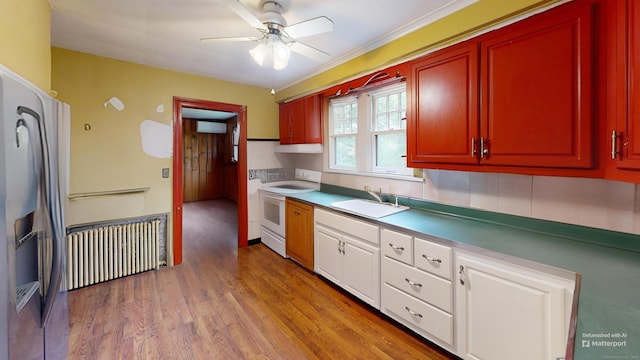 85 Hillcrest Ter, Meriden, CT 06450 - kitchen featuring electric stove, radiator heating unit, a sink, an AC wall unit, and ceiling fan