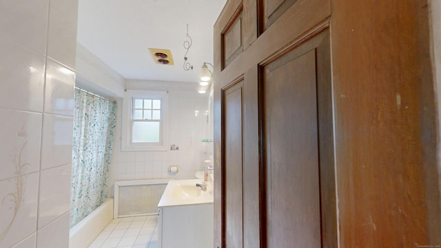 85 Hillcrest Ter, Meriden, CT 06450 - full bathroom featuring tile patterned floors, vanity, shower / bath combo with shower curtain, and tile walls
