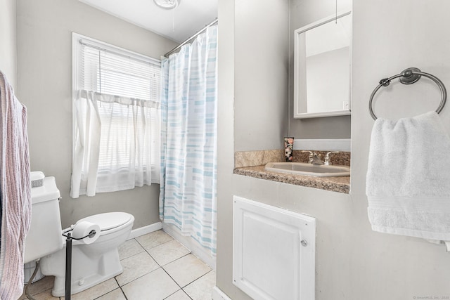 full bathroom with a sink, tile patterned floors, a shower with shower curtain, and toilet