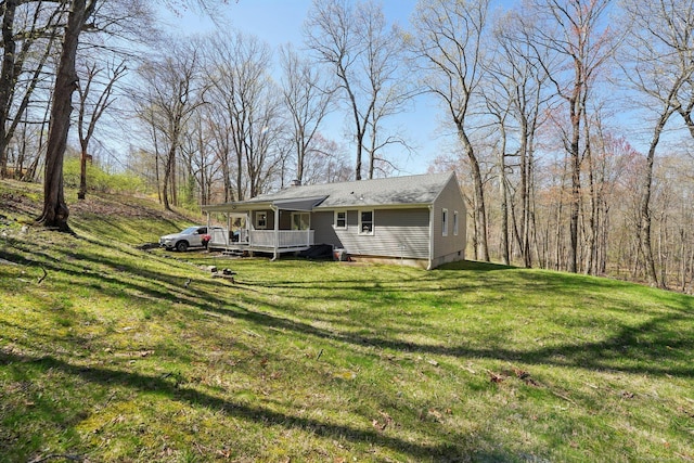 view of grassy yard with a deck