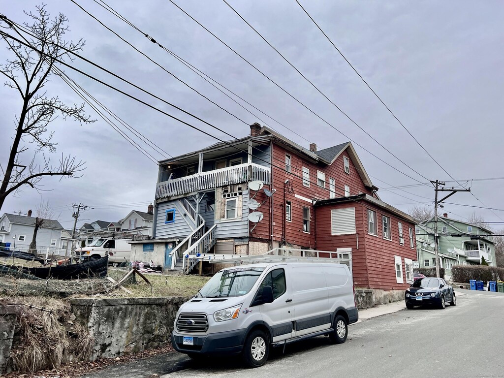 199 Hill St, Waterbury, CT 06704 - view of property exterior with a residential view and a chimney