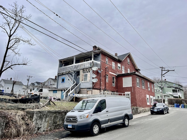 199 Hill St, Waterbury, CT 06704 - view of property exterior with a residential view and a chimney