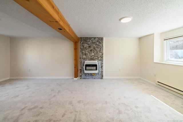 unfurnished living room featuring beamed ceiling, heating unit, a textured ceiling, carpet floors, and a baseboard radiator