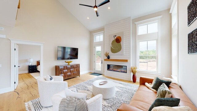 81 Shea Cir, Cheshire, CT 06410 - living area with ceiling fan, high vaulted ceiling, wood finished floors, and plenty of natural light