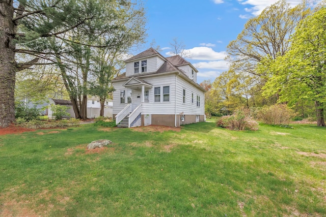 rear view of house with a lawn