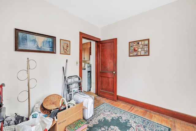 miscellaneous room with light wood-type flooring and baseboards