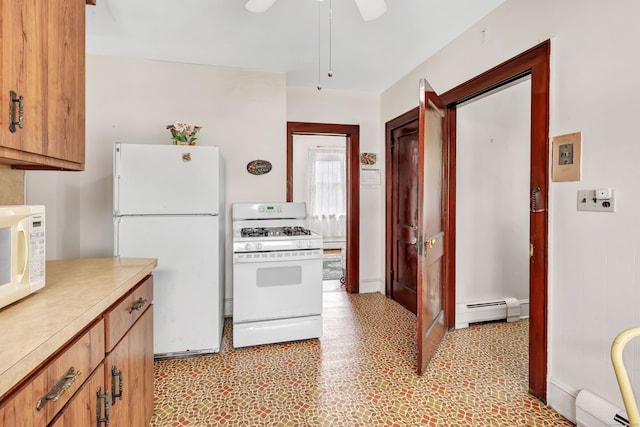 kitchen featuring ceiling fan, baseboard heating, white appliances, light countertops, and a baseboard radiator