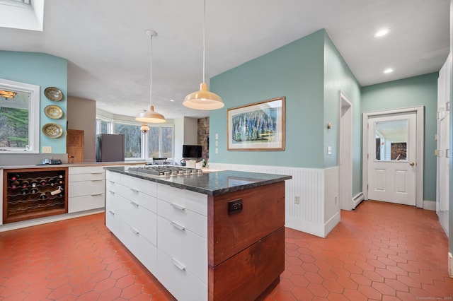 277 Milton Rd, Warren, CT 06756 - kitchen with modern cabinets, a wainscoted wall, a center island, white cabinetry, and recessed lighting