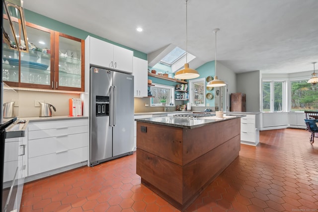 277 Milton Rd, Warren, CT 06756 - kitchen with appliances with stainless steel finishes, a kitchen island, white cabinets, dark tile patterned floors, and recessed lighting