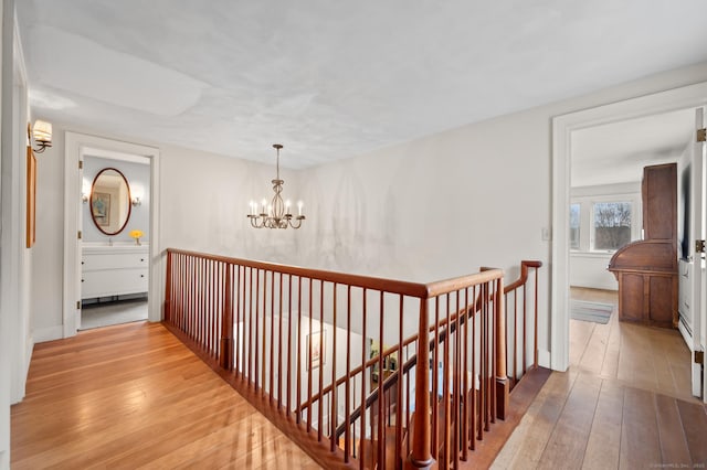 277 Milton Rd, Warren, CT 06756 - hall featuring an upstairs landing, a chandelier, and hardwood / wood-style flooring