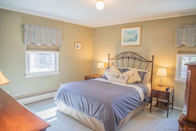 bedroom with ornamental molding, baseboard heating, and carpet