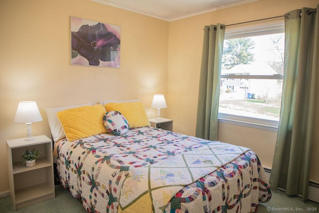 carpeted bedroom featuring crown molding and a baseboard heating unit