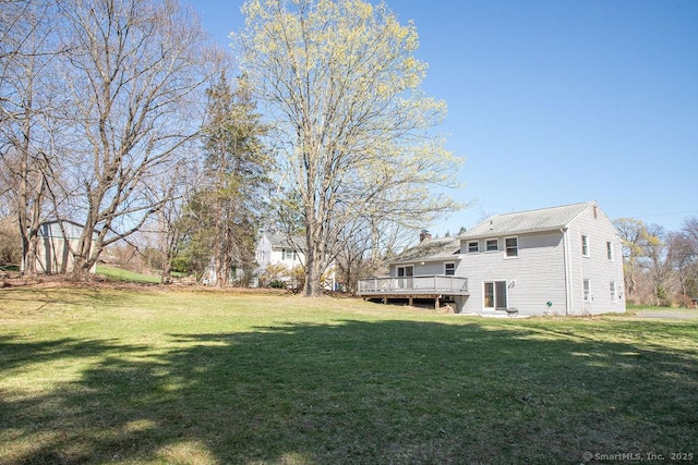 view of yard with a wooden deck