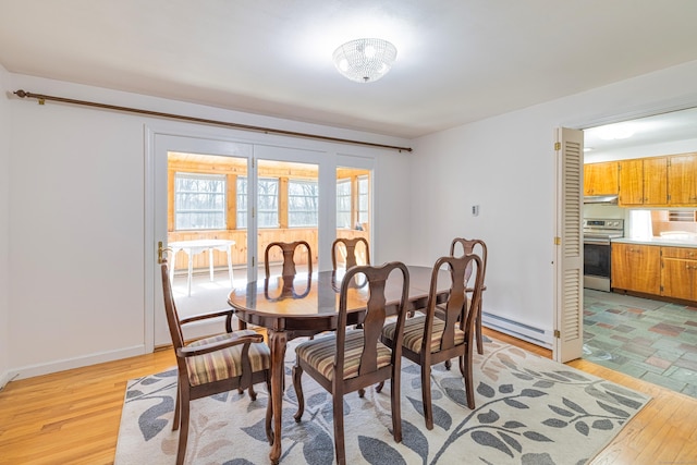 127 Separatist Rd, Mansfield, CT 06268 - dining area with a baseboard heating unit, light wood-style floors, and baseboards