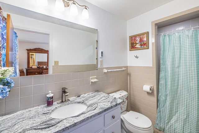 127 Separatist Rd, Mansfield, CT 06268 - bathroom featuring tile walls, toilet, vanity, a shower with curtain, and wainscoting