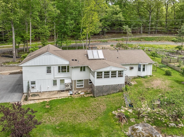 127 Separatist Rd, Mansfield, CT 06268 - back of property with a sunroom and roof with shingles