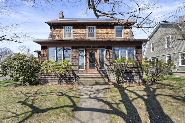 1228 Wells Pl, Stratford, CT 06615 - traditional style home with a chimney, solar panels, a front yard, and entry steps