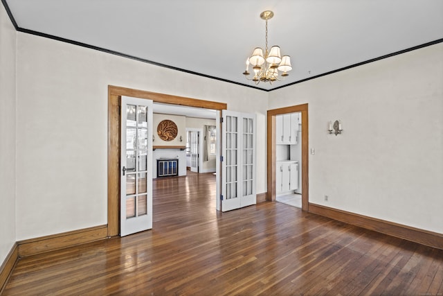 1228 Wells Pl, Stratford, CT 06615 - empty room featuring hardwood / wood-style flooring, a chandelier, baseboards, and french doors