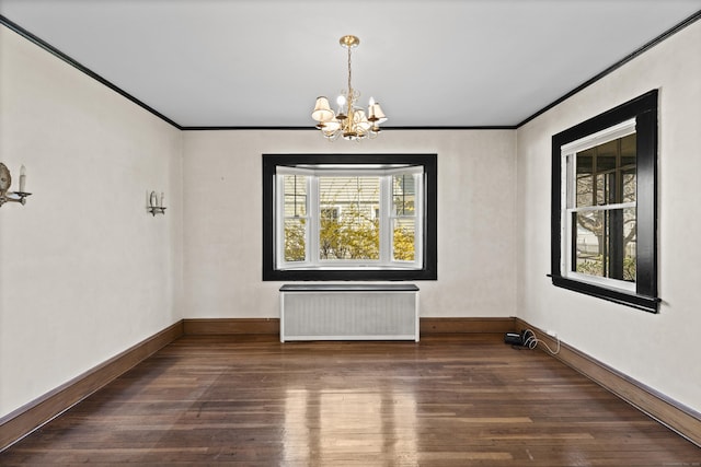 1228 Wells Pl, Stratford, CT 06615 - empty room featuring radiator, a chandelier, hardwood / wood-style flooring, crown molding, and baseboards