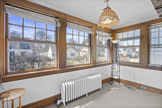 1228 Wells Pl, Stratford, CT 06615 - sunroom featuring radiator heating unit, carpet flooring, ornamental molding, a chandelier, and baseboards
