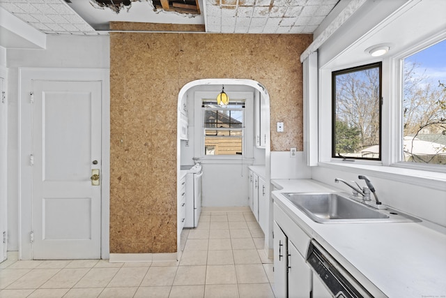 1228 Wells Pl, Stratford, CT 06615 - kitchen with a sink, light countertops, light tile patterned floors, and white cabinets