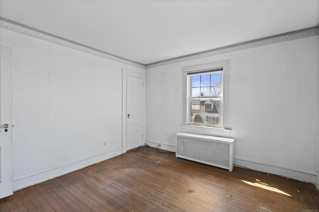 1228 Wells Pl, Stratford, CT 06615 - unfurnished room featuring radiator heating unit and wood-type flooring