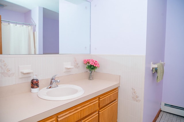 33 Oxford Dr, South Windsor, CT 06074 - bathroom with a baseboard heating unit, vanity, and wainscoting
