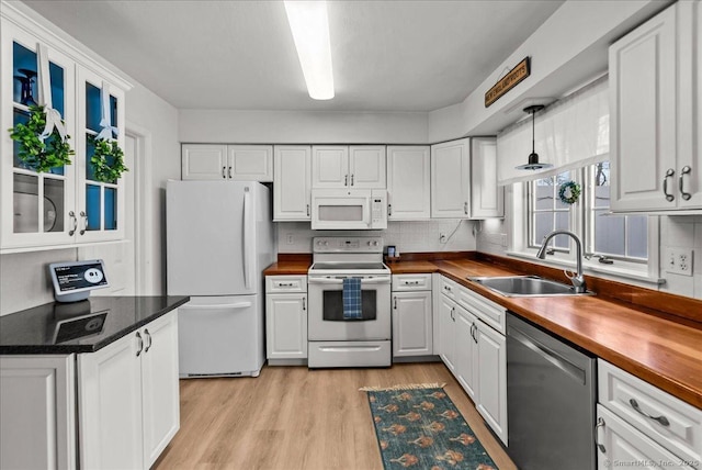 13 Brantwood Dr Unit 13, Madison, CT 06443 - kitchen with white appliances, a sink, wooden counters, and white cabinets