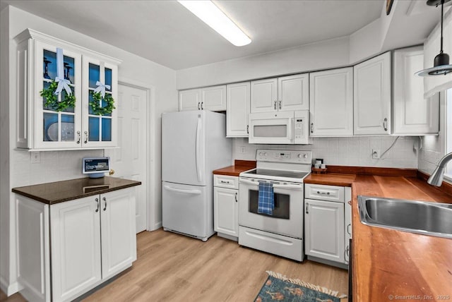 13 Brantwood Dr Unit 13, Madison, CT 06443 - kitchen featuring white appliances, a sink, wooden counters, decorative backsplash, and white cabinets
