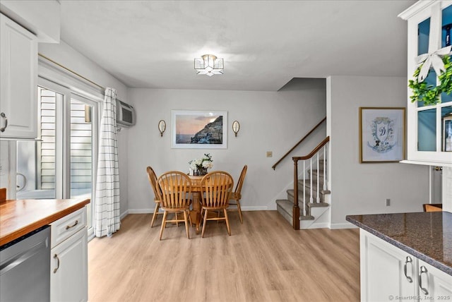 13 Brantwood Dr Unit 13, Madison, CT 06443 - dining area with light wood-style floors, stairway, baseboards, and an AC wall unit
