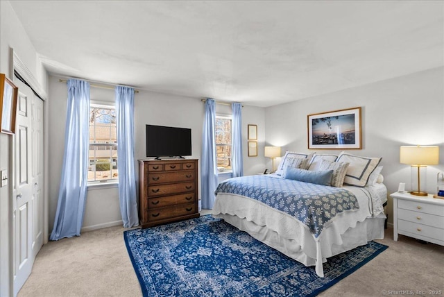 13 Brantwood Dr Unit 13, Madison, CT 06443 - carpeted bedroom featuring multiple windows, baseboards, and a closet