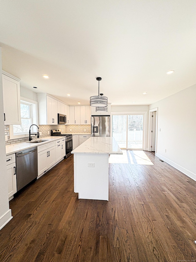 88 Walnut Trl, Danbury, CT 06810 - kitchen featuring appliances with stainless steel finishes, a sink, decorative backsplash, dark wood finished floors, and recessed lighting