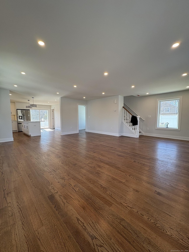 88 Walnut Trl, Danbury, CT 06810 - unfurnished living room featuring stairway, baseboards, dark wood-style flooring, and recessed lighting