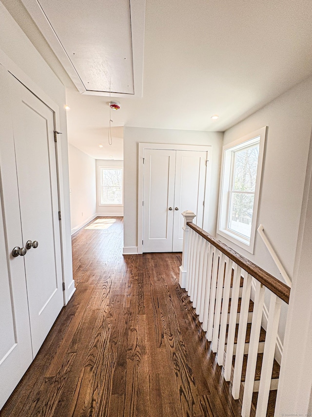 88 Walnut Trl, Danbury, CT 06810 - corridor with attic access, dark wood-style flooring, an upstairs landing, and baseboards