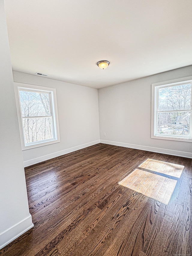 88 Walnut Trl, Danbury, CT 06810 - empty room featuring dark wood-style flooring, plenty of natural light, and baseboards