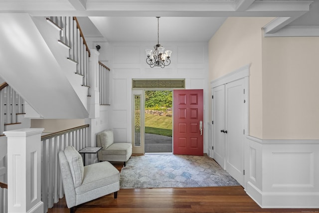 360 New London Tpke, Stonington, CT 06378 - entrance foyer featuring wood finished floors, a decorative wall, stairway, and a chandelier