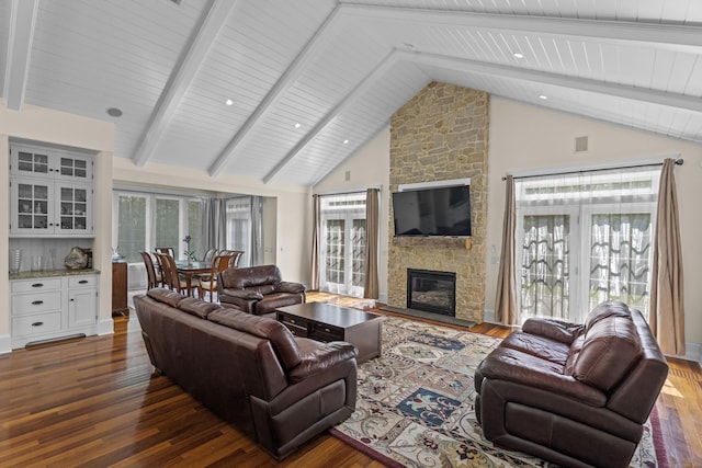 360 New London Tpke, Stonington, CT 06378 - living room featuring wood finished floors, high vaulted ceiling, a stone fireplace, and a wooden ceiling with exposed beams